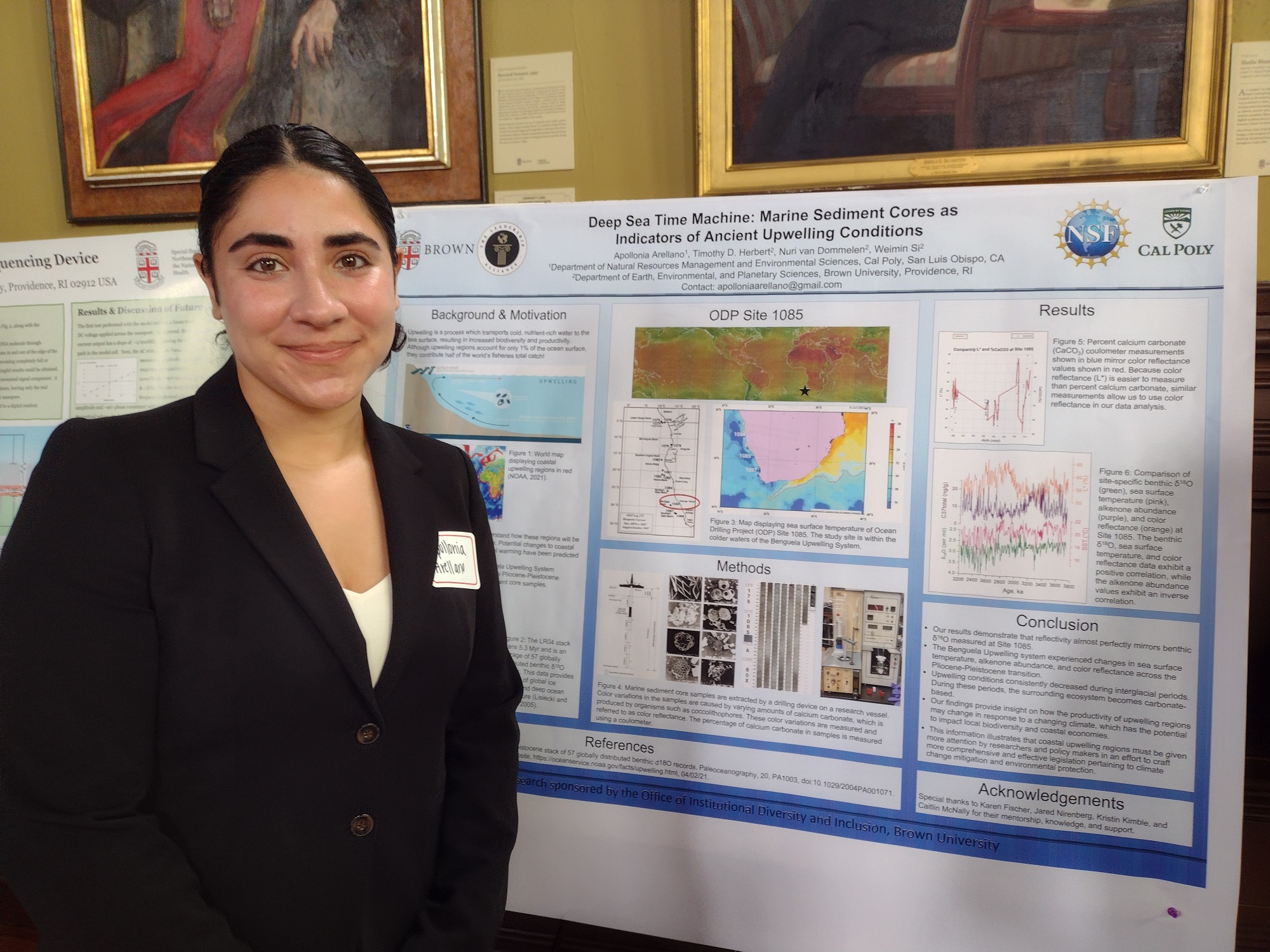Apollonia poses with her research poster. 
