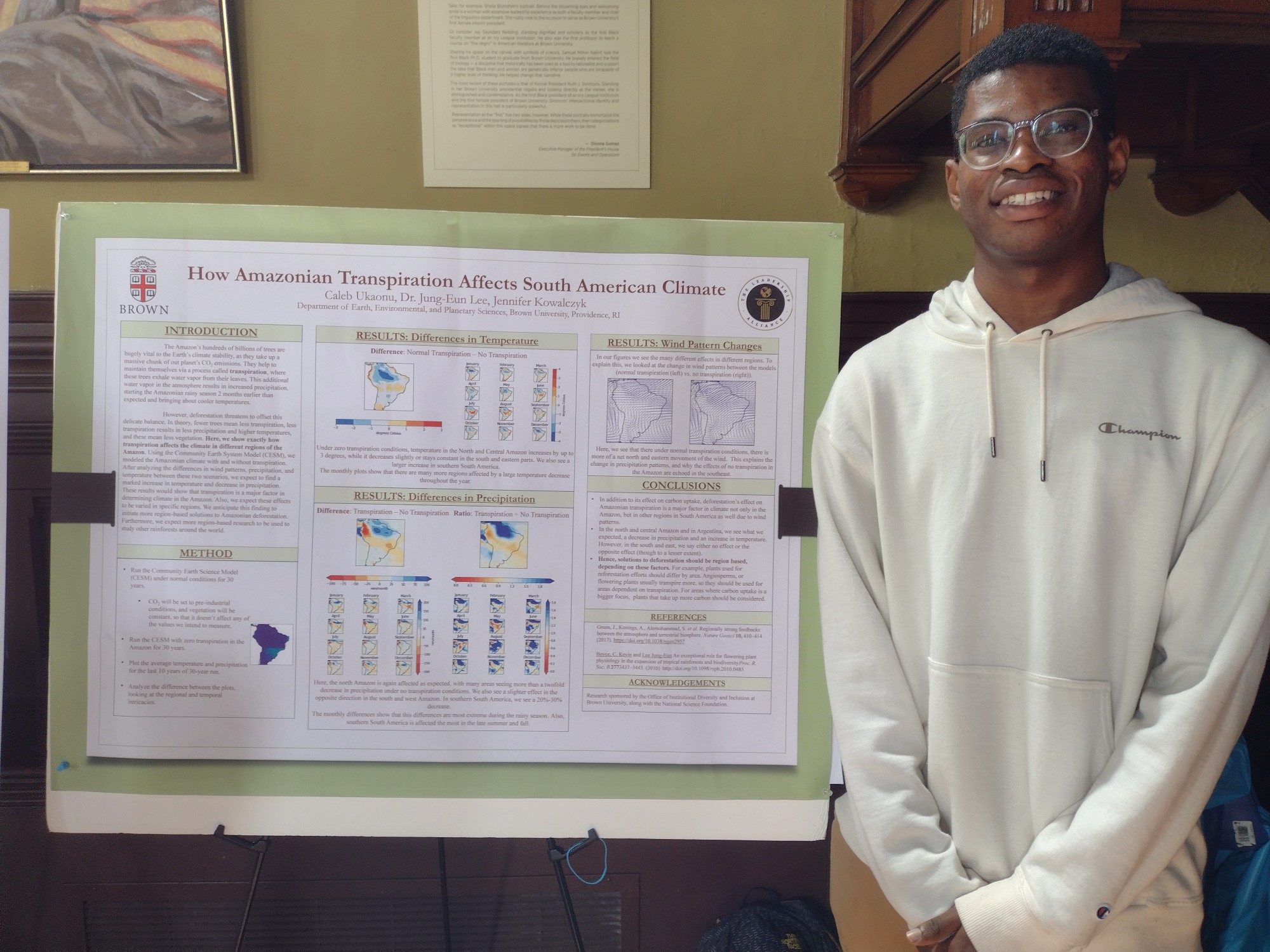 Caleb poses with his research poster.