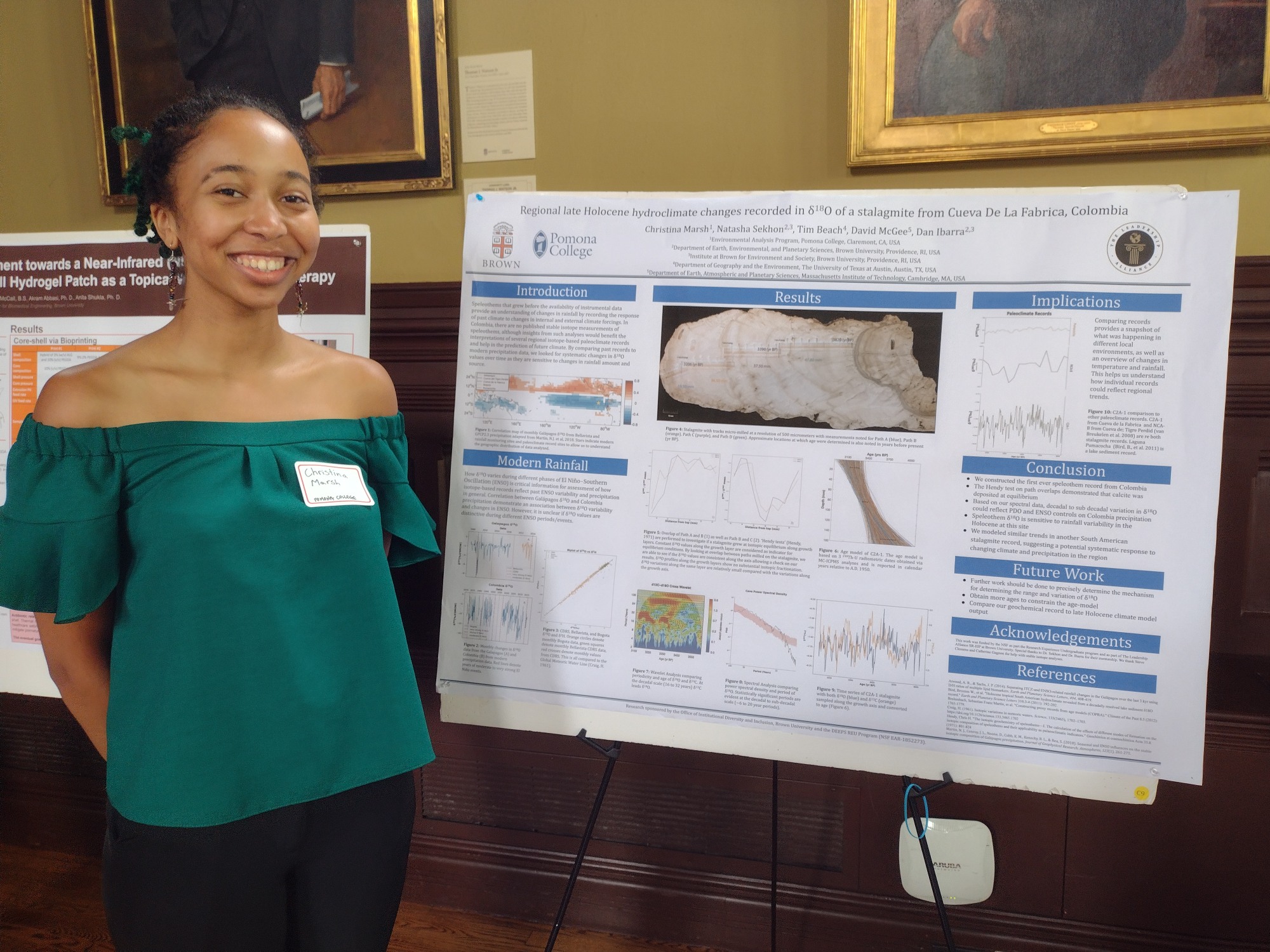 Christina poses with her research poster. 