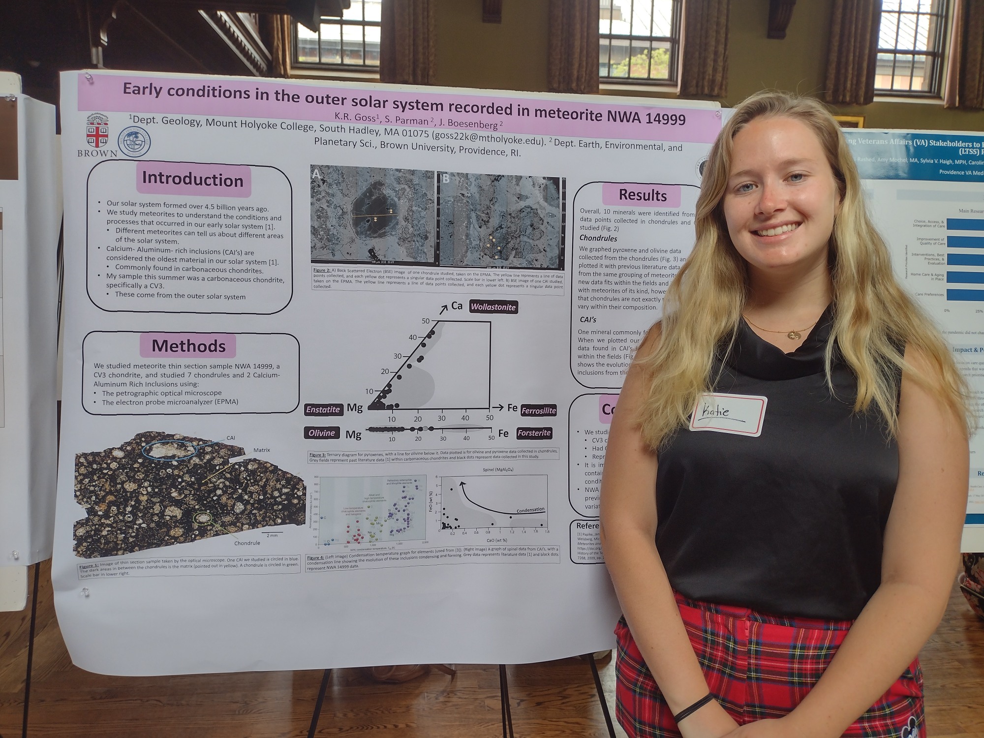 Katie poses with her research poster. 