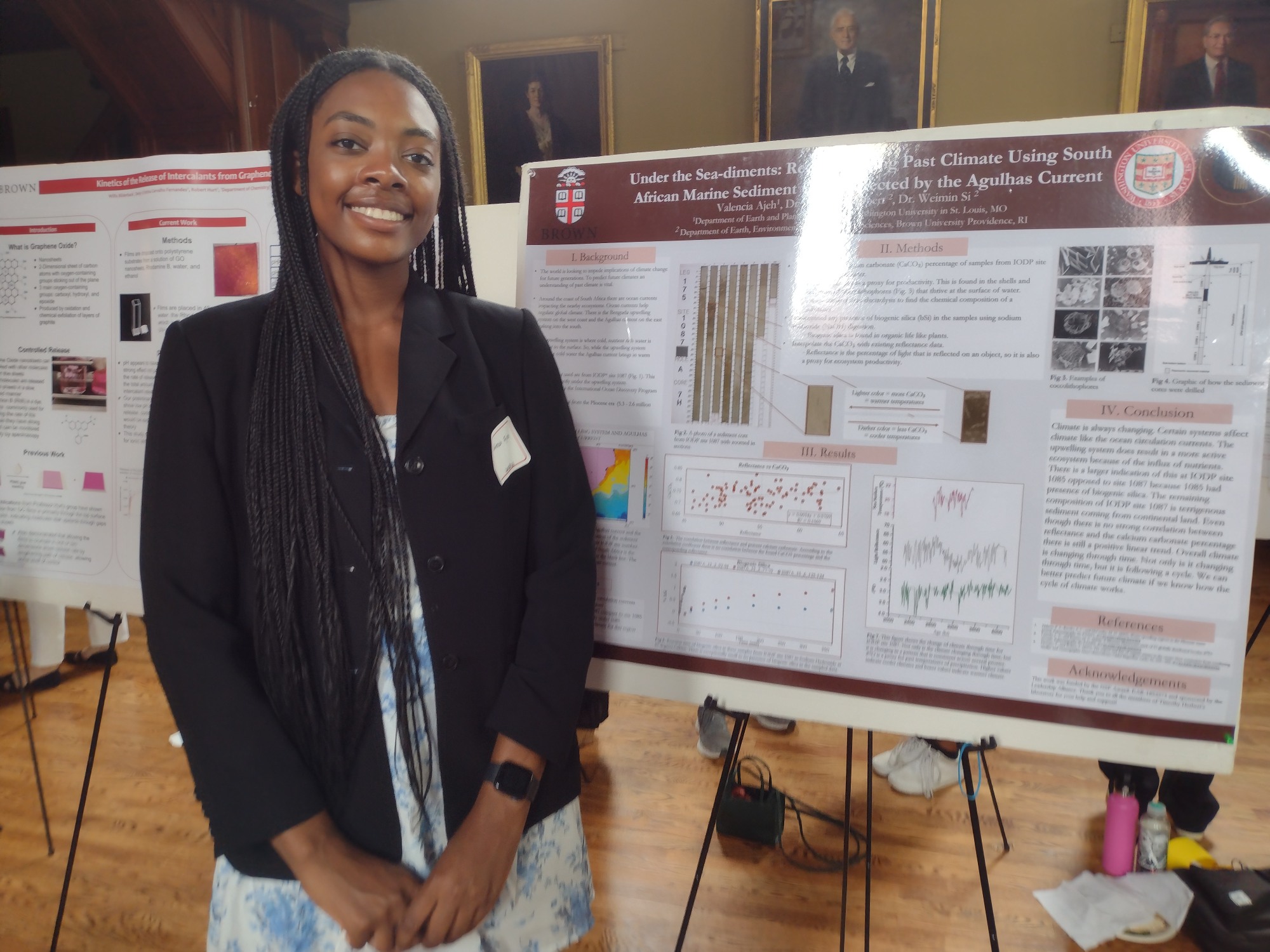Valencia poses with her research poster. 