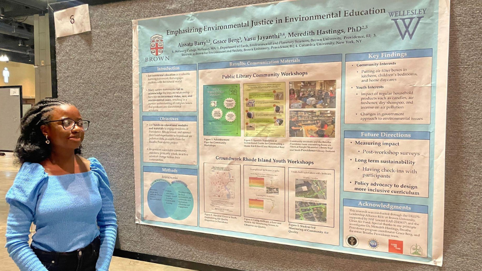 Aissata Barry with her poster at a research conference. 