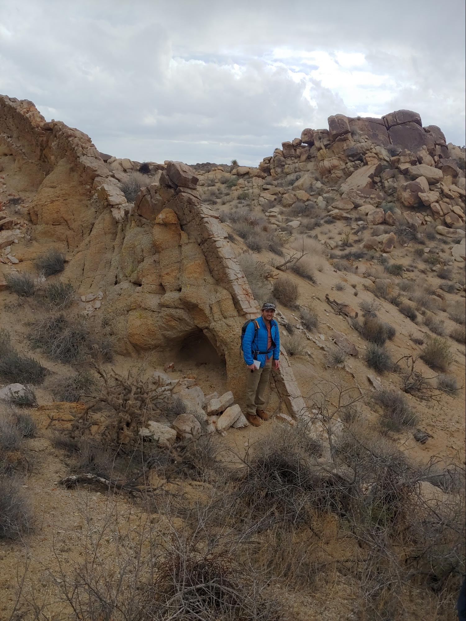 Darien Florez doing field research in the desert.