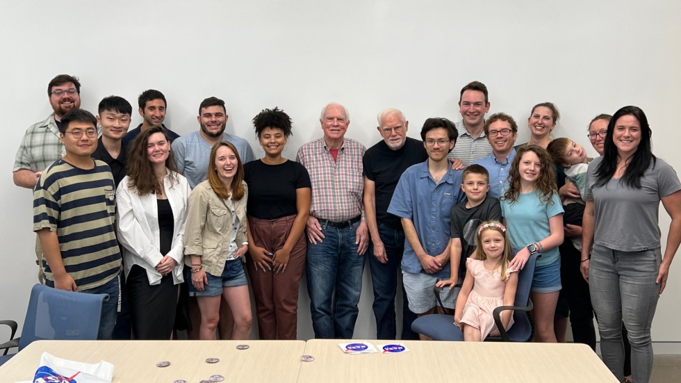 The Planetary Research Group poses for a photo with David Scott. 