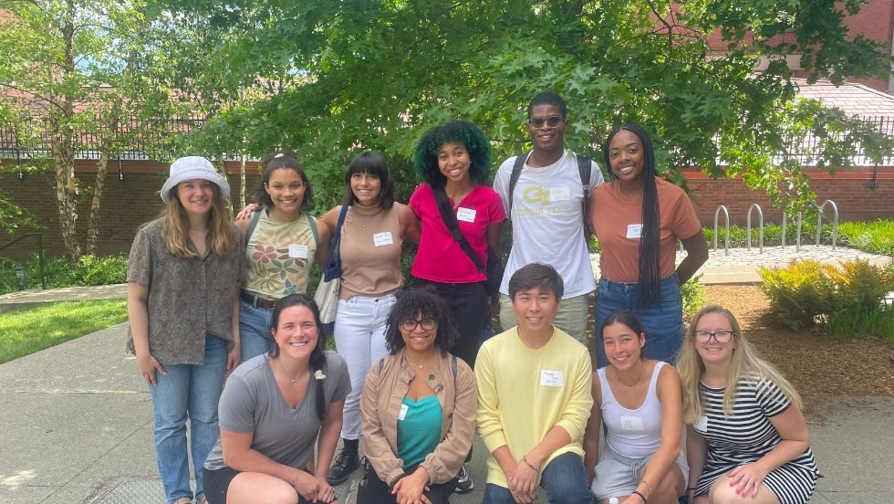 11 undergraduates posing for an outdoor photo. 