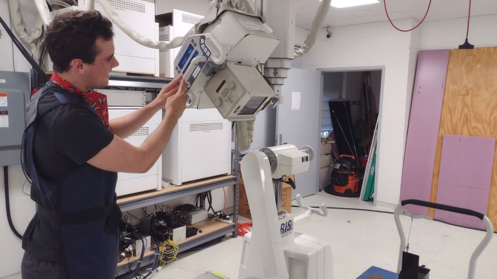 Josiah pointing the x-ray at a sample. 