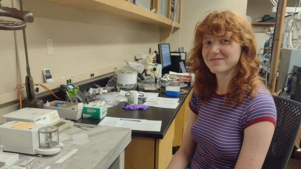 Marlena sitting in the lab, smiling for the photo. 