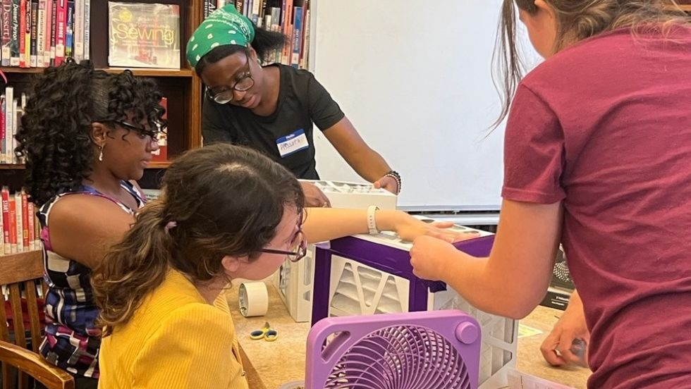 Students working on DIY air filters at a Providence Public Library event. 