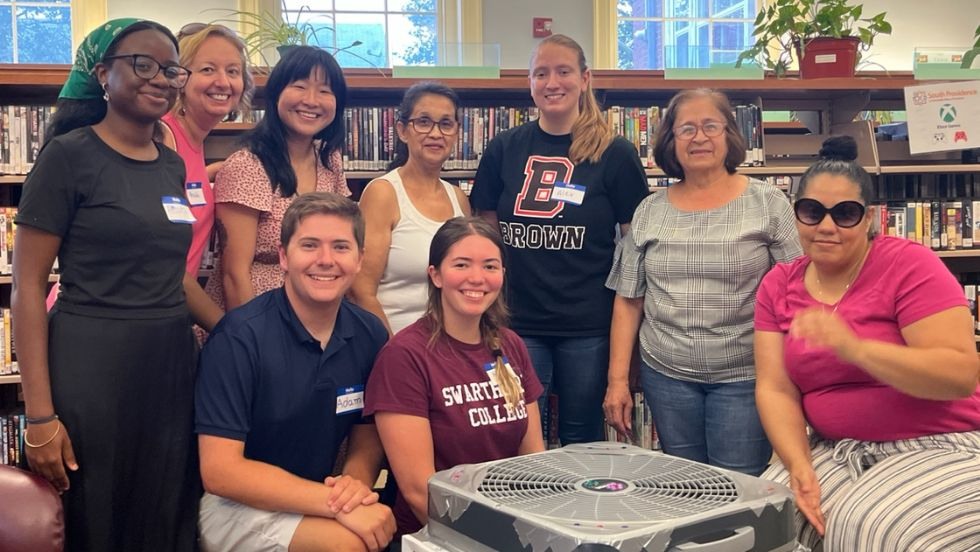 REU students and library program guests pose for a photo. 