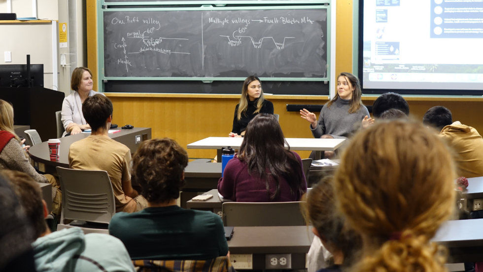 Isabella Gama Dantas and Mali'o Kodis answering questions together at the front of the room. 