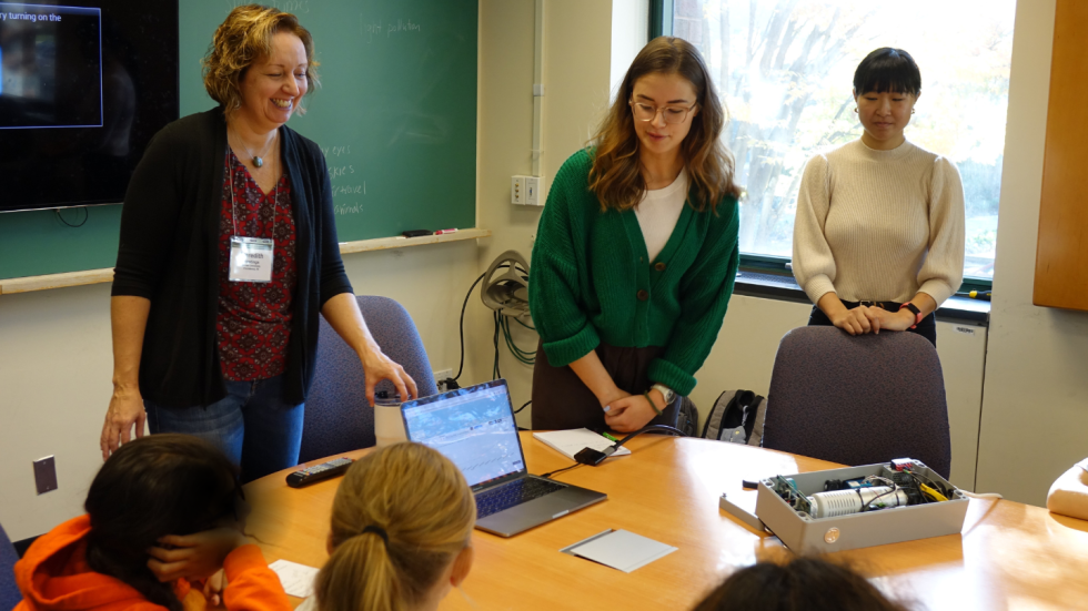 Meredith Hastings and her team showing students the tools they use to study air pollution. 