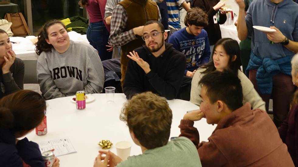 A candid photo of students talking and laughing together. 