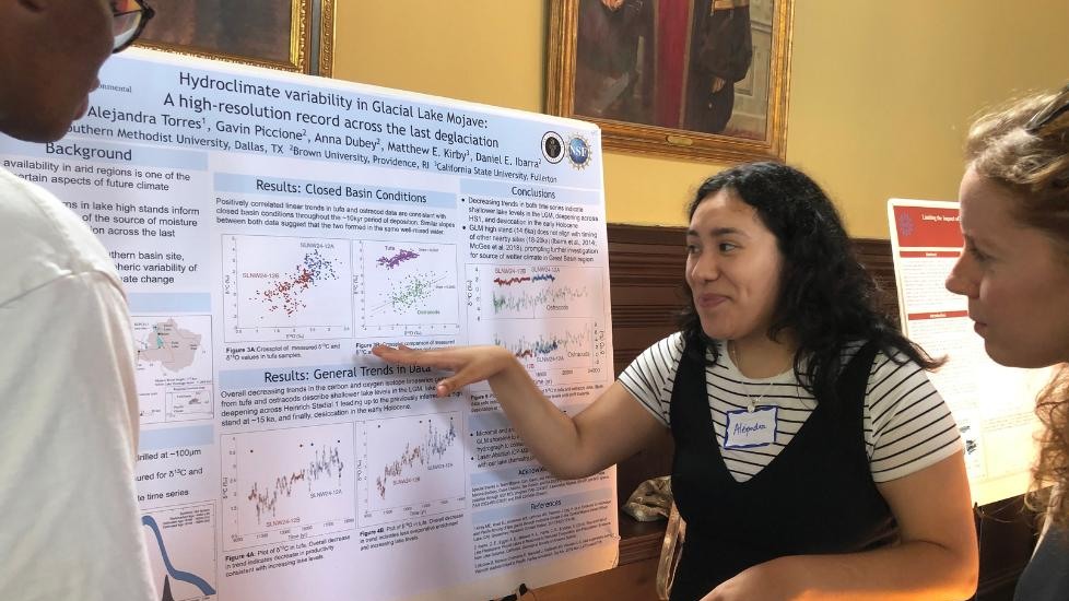 Alejandra Torres presenting her poster at event 