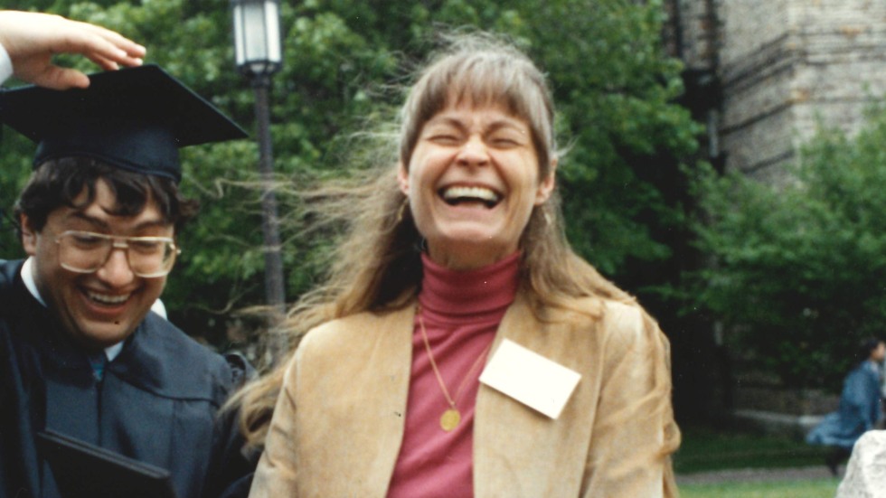 Jan laughing with a student at graduation 1992