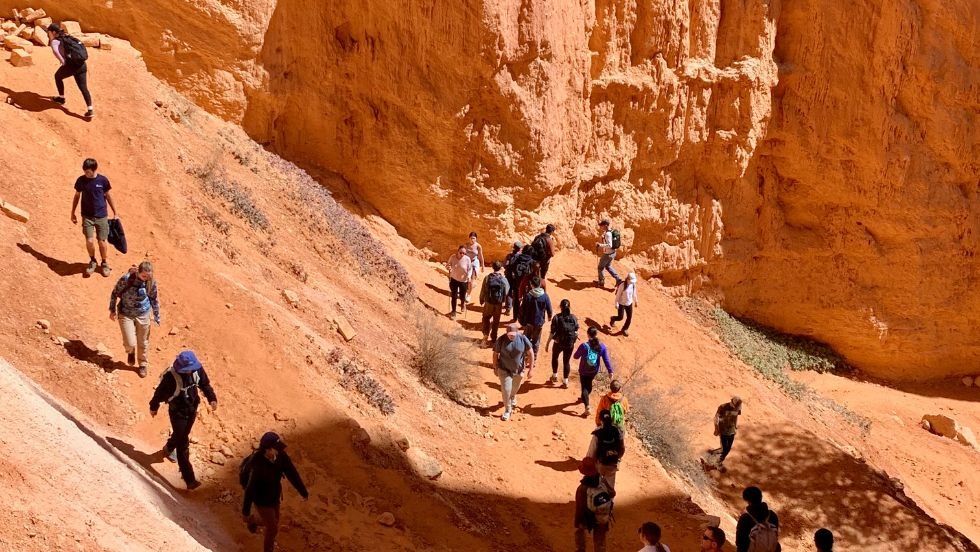 students hiking up another rocky trail