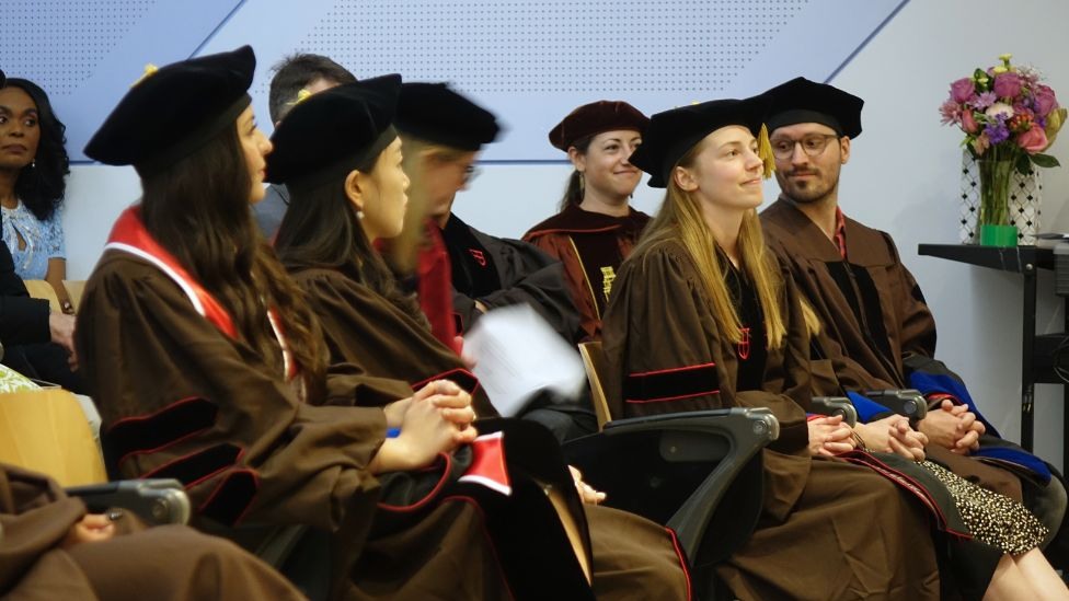 graduates chatting before the ceremony