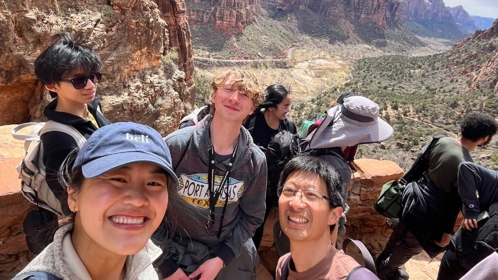 students pause to take a selfie while hiking