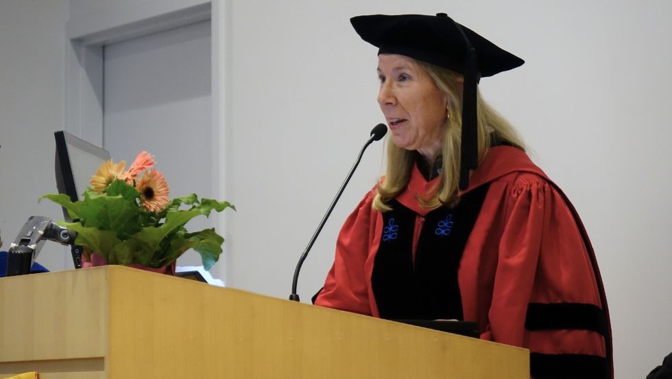 Prof Colleen Dalton speaking from the podium