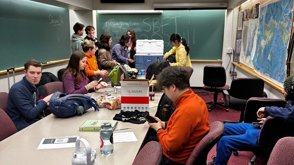 students preparing for the trip in a department classroom