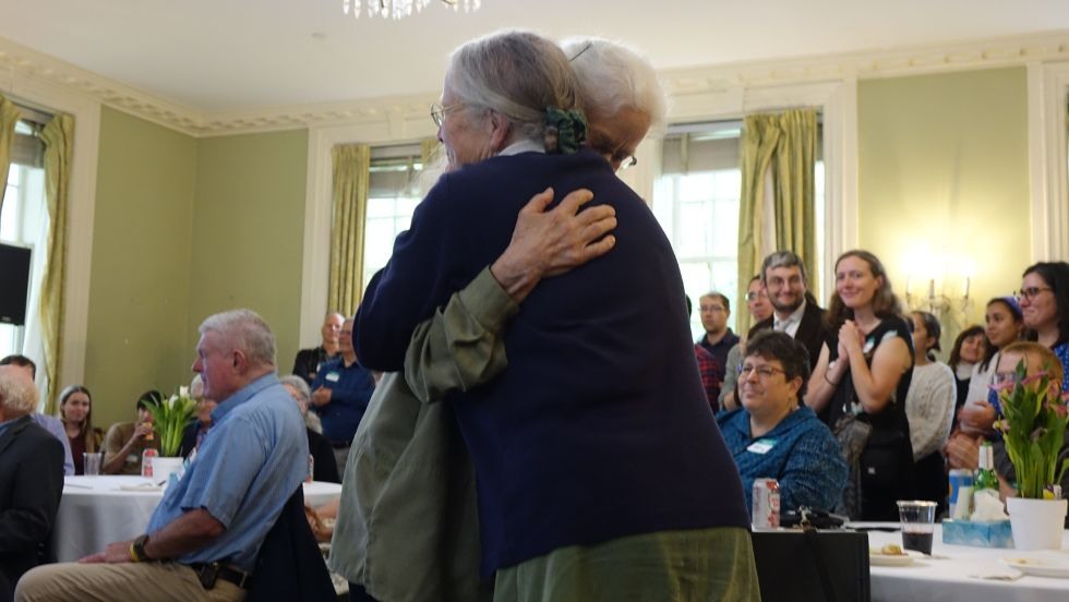 Ellen Shelton and sister hug during Jan memorial reception 