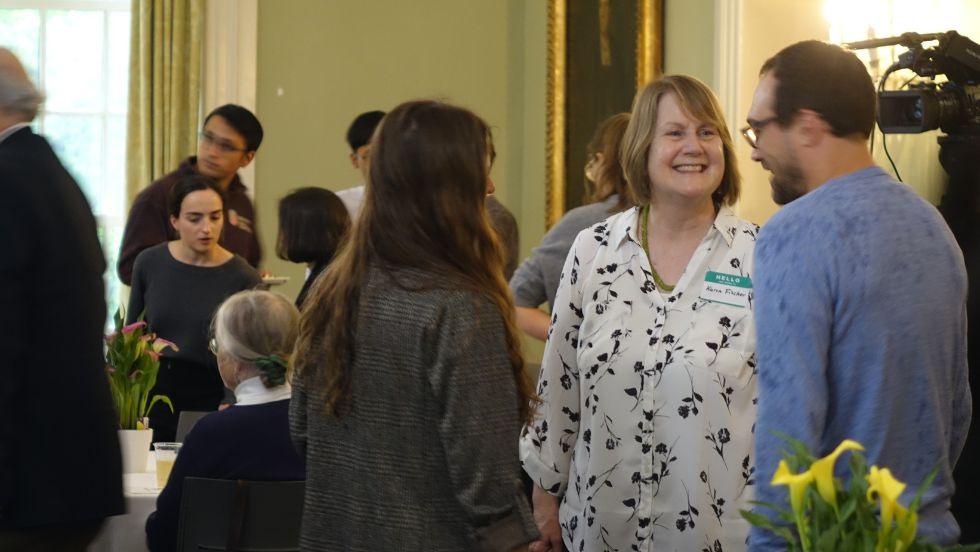 Karen Fischer and others mingling during the reception 