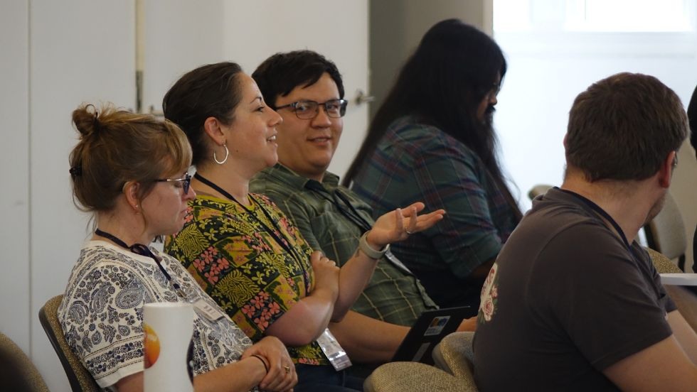 a faculty member asks a question during a presentation 