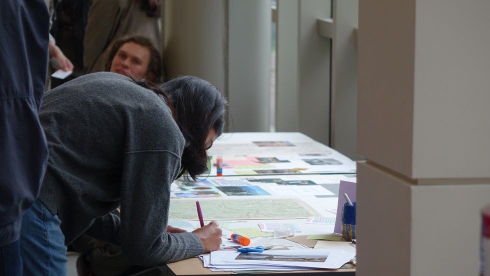folks adding notes to the Jan memorial tapestry project 