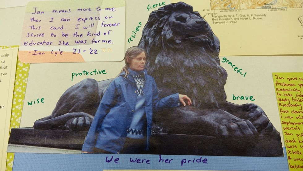 A closeup of a note and photos on the Jan memorial tapestry 