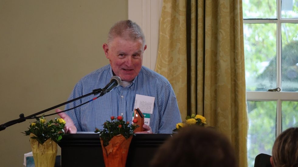 Bill Collins speaks at the reception 