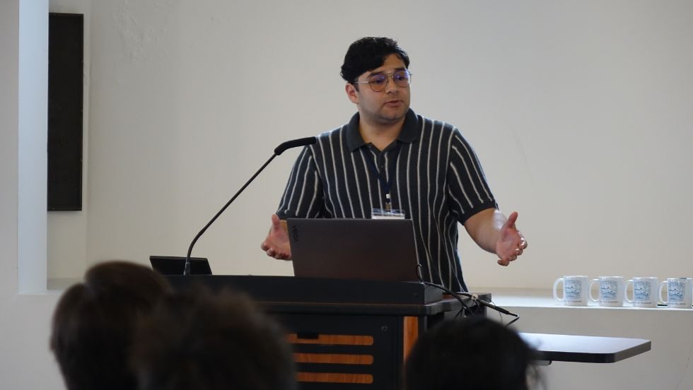a graduate student presents his research 