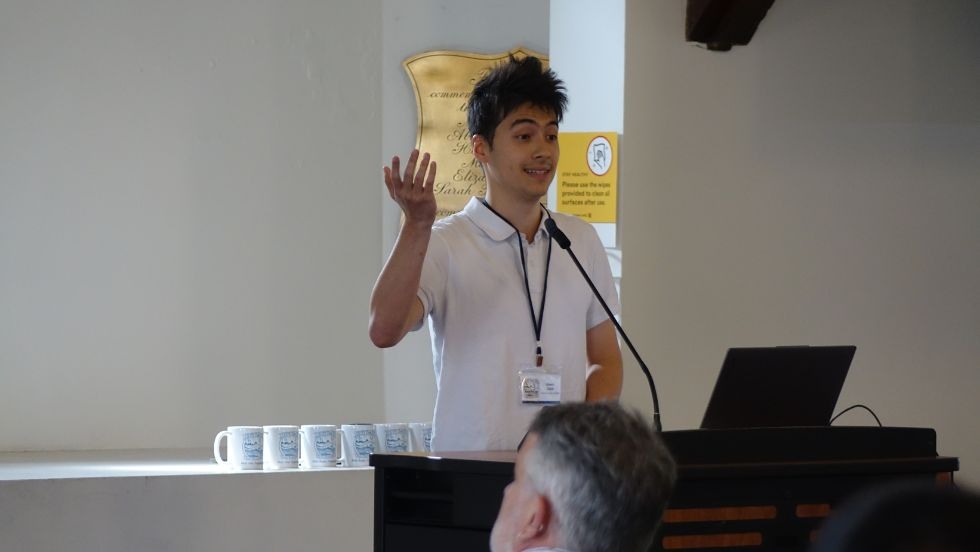 an undergraduate student presents his research 