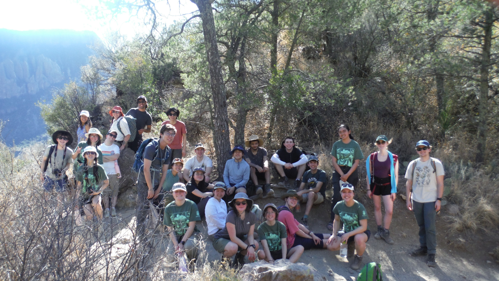 students pause on a hike in the mountains for a group photo 
