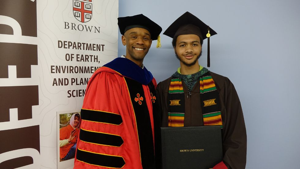 an undergrad and their advisor pose together for a photo 