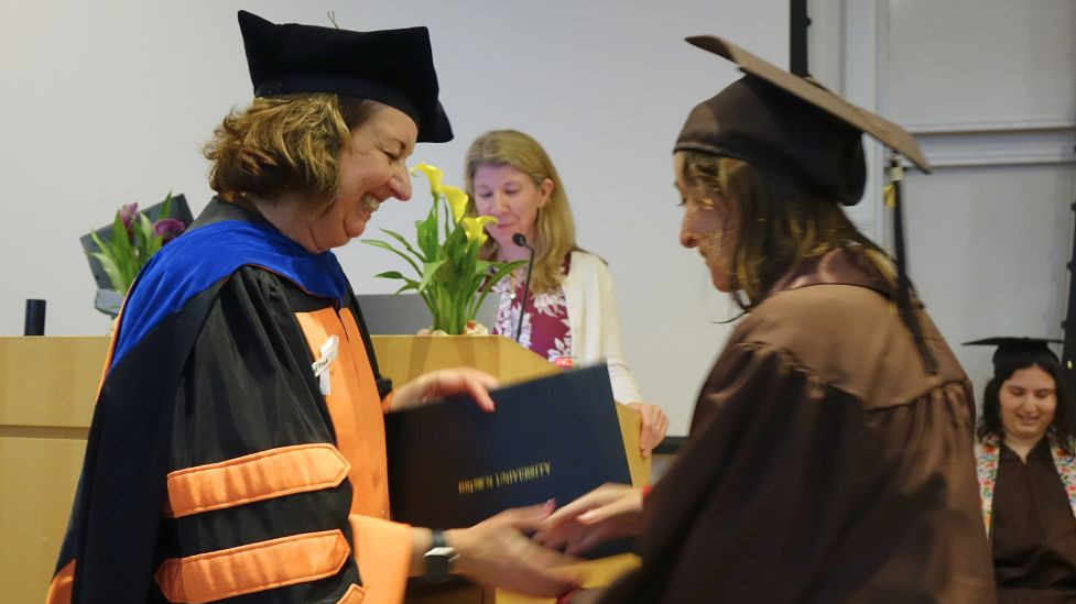 the chair awards an undergraduate her degree 