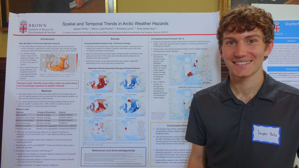 Jasper Perlis beside his poster 