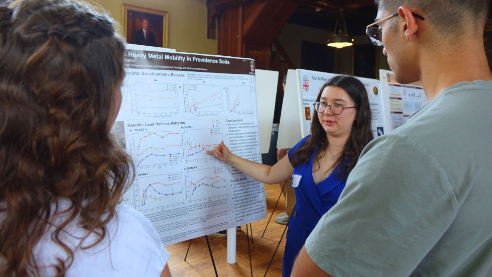 Sarah Levine explaining her poster to peers 
