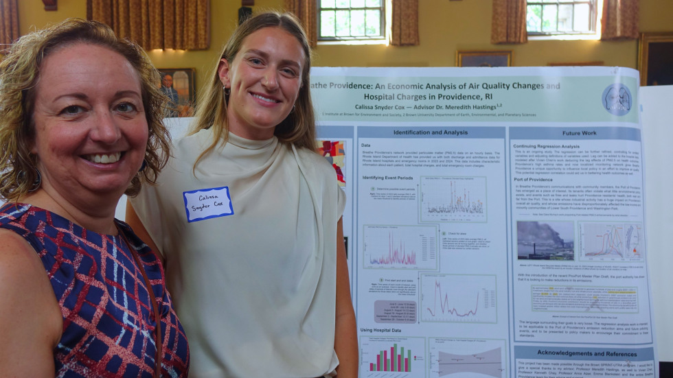 Calissa Snyder Cox  and Professor Meredith Hastings beside Calissa's poster 
