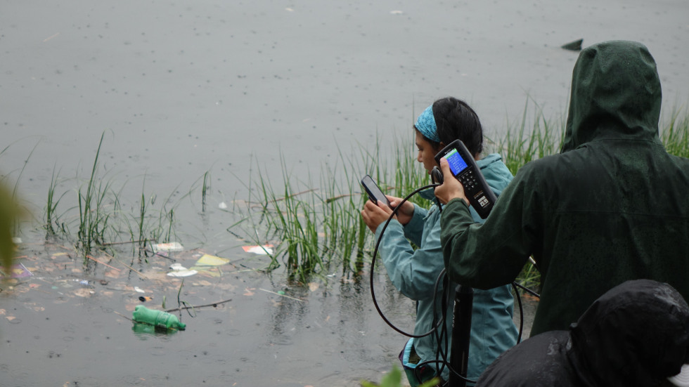 The team wading into the water for samples 