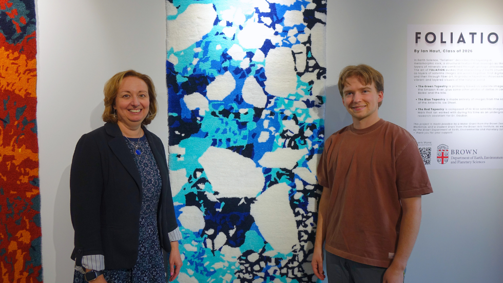 Meredith Hastings and Ian pose beside the ice tapestry