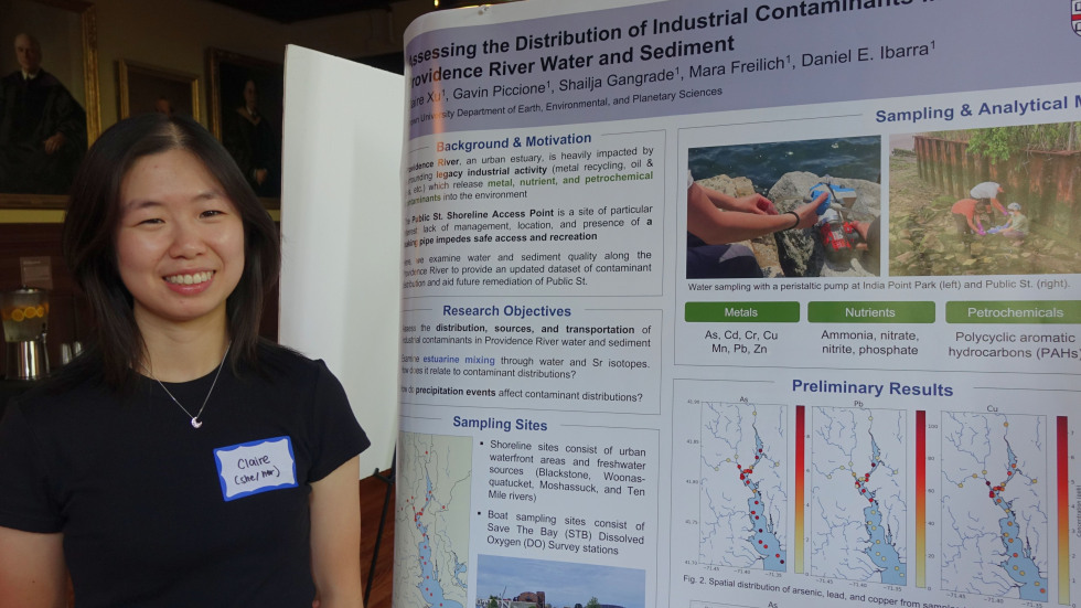 Claire Xu beside her poster 