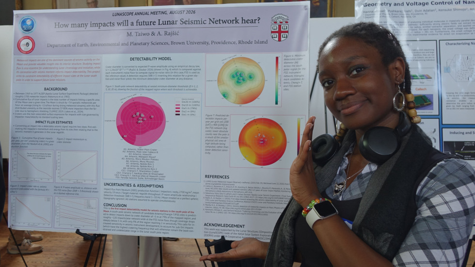 Mabel Taiwo beside her poster 