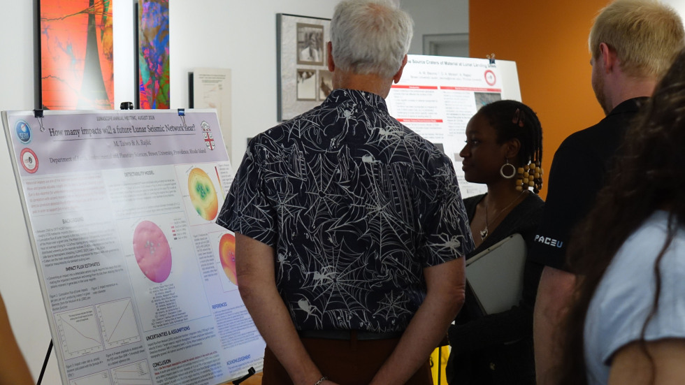 Mabel Taiwo sharing her poster at the LunaSCOPE annual meeting