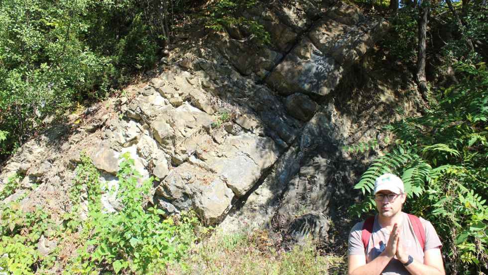 Professor Hodgin beside the rockface 